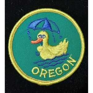 Oregon Duck with umbrella 3" sew-on patch green background